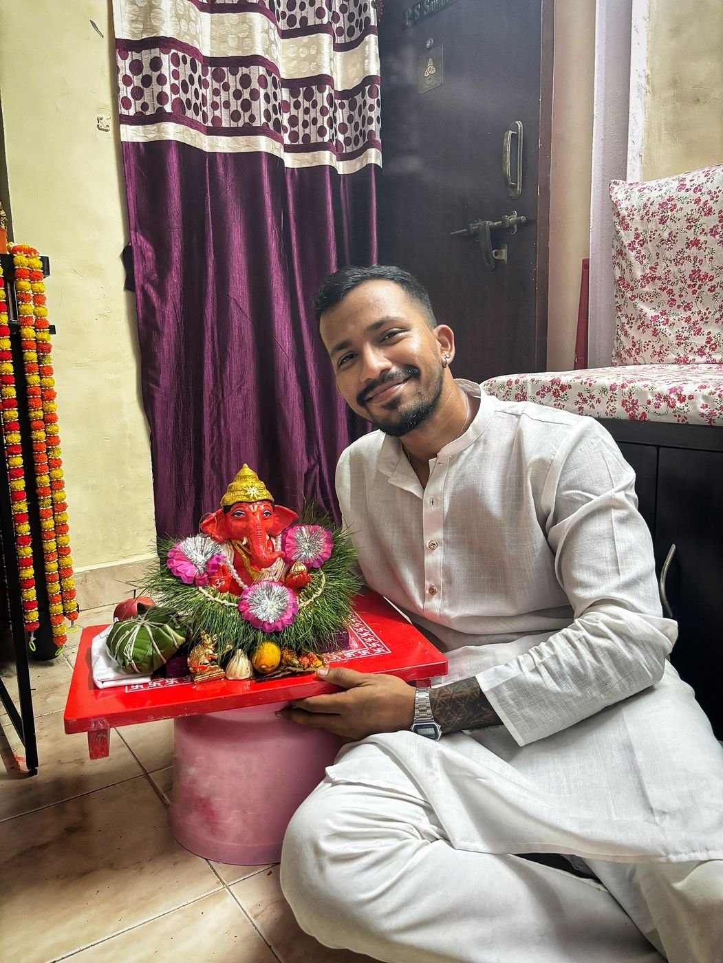 Ninad welcoming a Ganpati idol at home
